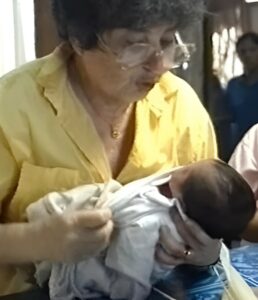 Dr Lilly Dubowitz examining a baby